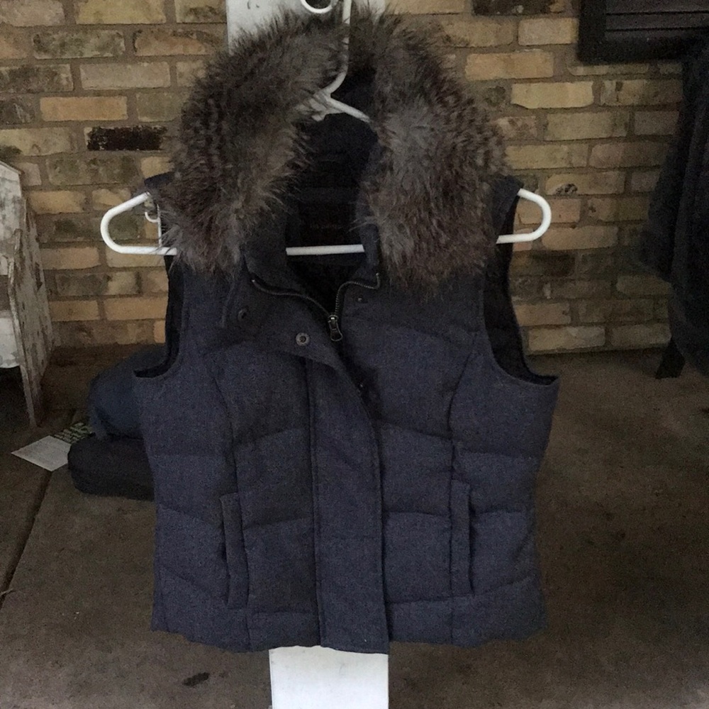 Limited vest with removable fur collar.